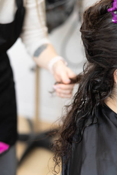 istock Cold hair restoration on textured curls in a salon 2194036272