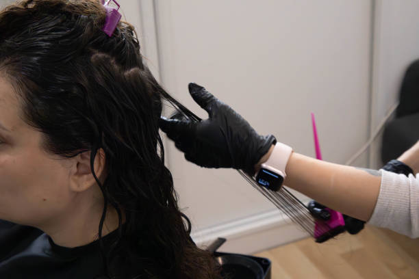 istock Hair treatment process in a salon for enhancing natural curls 2194036449