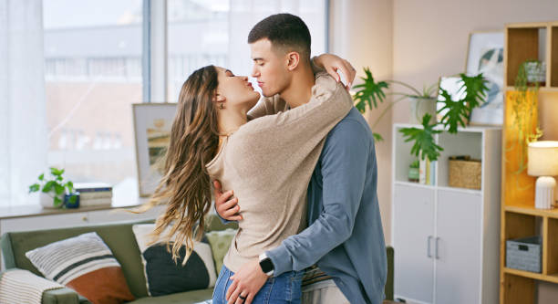 istock Hug, house and happy couple with love, commitment and bonding together with relationship. Apartment, marriage and man with woman, embrace and trust with romance, support and kiss with date and relax 2194037806