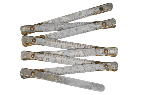 istock Antique carpenter's brass ruler isolated on white. 2194038710
