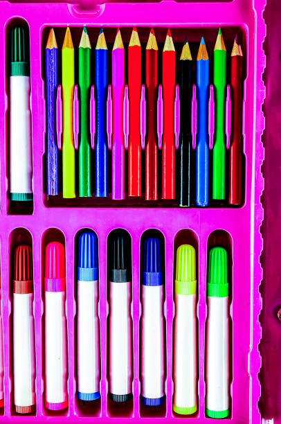 istock A box of colored pencils with a pink cover 2194039220