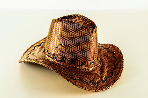 istock A gold cowboy hat with sequins on it 2194039222