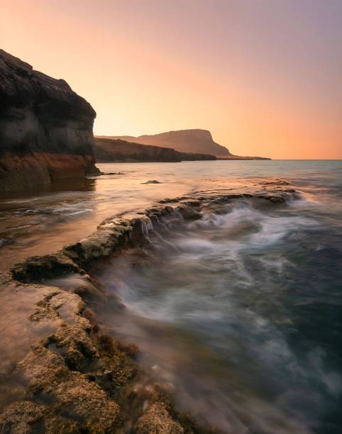 Sun sets over Bolt Tail headland in Devon