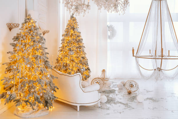 istock Christmas decorations in a cozy winter setting with trees and gifts 2194040039