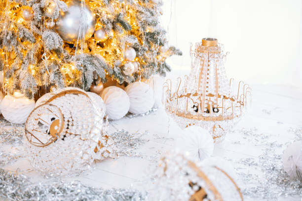 istock Decorative Christmas tree with golden ornaments and gift boxes for the holidays 2194040099