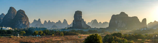 istock Vibrant Sunrise Over the Breathtakingly Beautiful Scenery and Dramatic Limestone Rock Formations of the Yulonghe Scenic Area of Yangshuo County, Guilin, GuangxiChina 2194041005