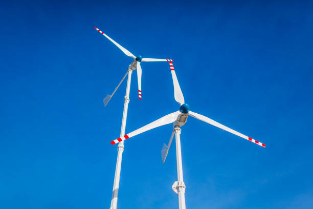 istock Solar energy panel and wind turbines power generator in mountains at sunset. Production of renewable green energy. 2194041287