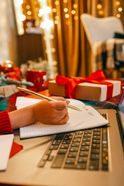 istock Child writes in notebook, Christmas mood 2194048109