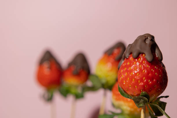 istock Close up of strawberries with melted chocolate on a pink background with copy space Valentine's Day 2194050892