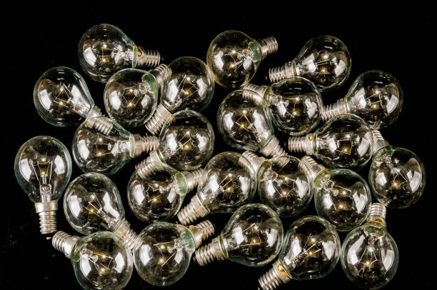 istock A bunch of light bulbs are on a black background 2194051621