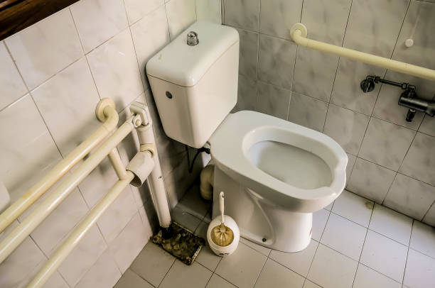 This image features two clean white urinals mounted in a modern public bathroom, emphasizing hygiene and functionality in a simple design.