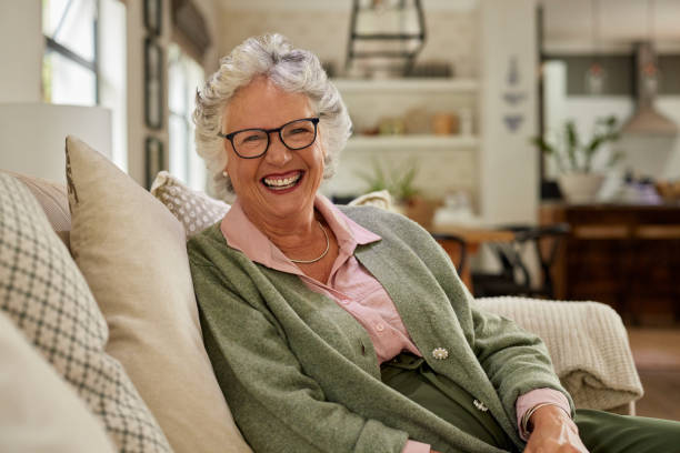 Senior beautiful woman laughing while looking at camera