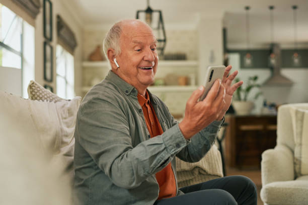 istock Elder happy man on video call at home 2194052267