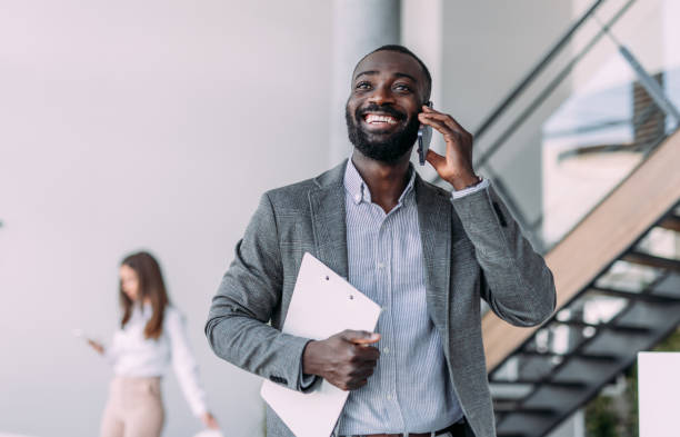 istock Businessman talking on the phone in the office. 2194052318