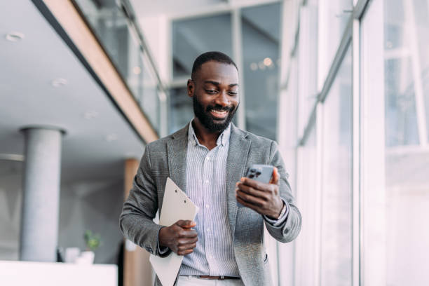 istock Businessman texting in the office. 2194052334