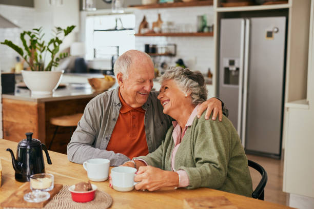 istock Loving senior couple embracing while looking at each other 2194052620