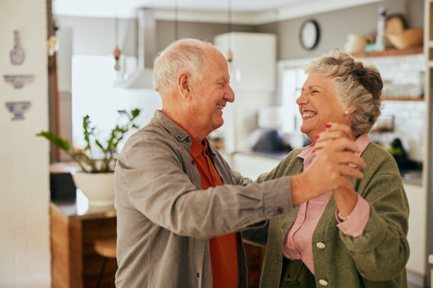 istock Loving senior couple dancing at home with joy 2194053021