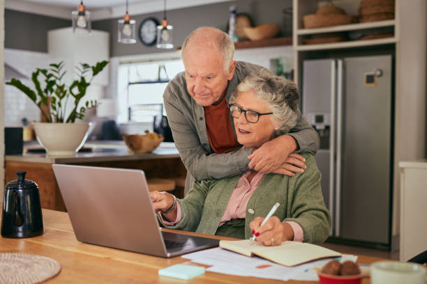 istock Senior couple using laptop to manage home finance 2194053025