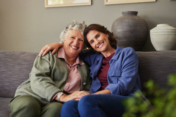 istock Smiling loving daughter and old mother looking at camera 2194054350