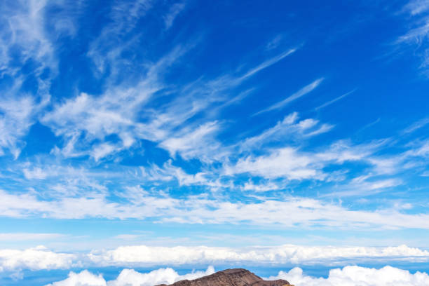 Clouds over the island Maui. The Hawaiian archipelago in the Pacific Ocean. Incredible surroundings of the observatory Haleakala.