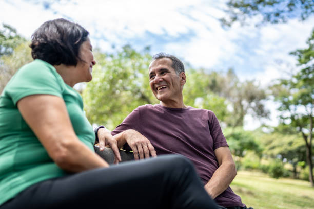 istock Senior friends talking in a public park 2194057593