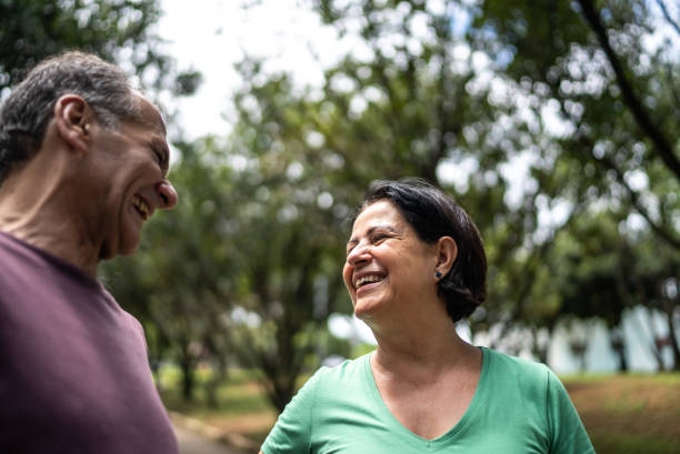 istock Senior friends talking in a public park 2194057617