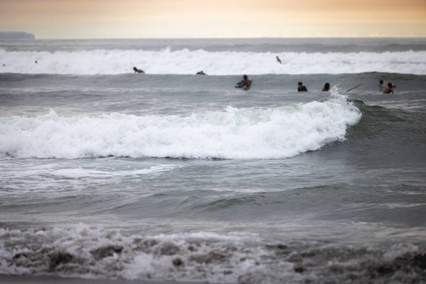 istock Canggu beach landscape with breaking waves at sunset. 2194060559