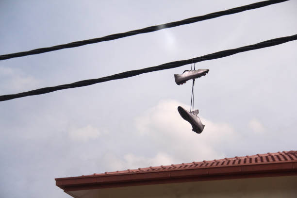 Palermo, Sicily, Italy Sneakers thrown over power lines in the street.