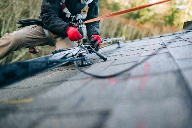 istock Solar Energy Technician Working To Install Solar Panels on Residential Roof 2194060723