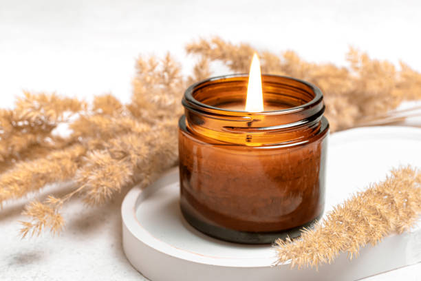 istock Burning scented candle and dry reeds grass 2194061952