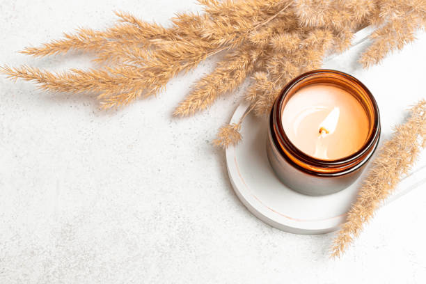 istock Burning aroma candle and dry reeds grass 2194061954