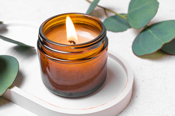 istock Burning soy wax candle and eucaliptus leaves 2194061960