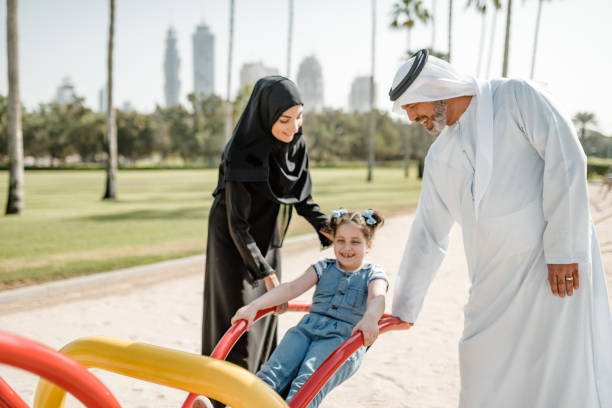 istock arab family playing at the park 2194063112