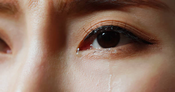istock tears rolling down woman eye 2194063498