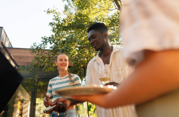 istock Happy friends barbecuing together 2194064808