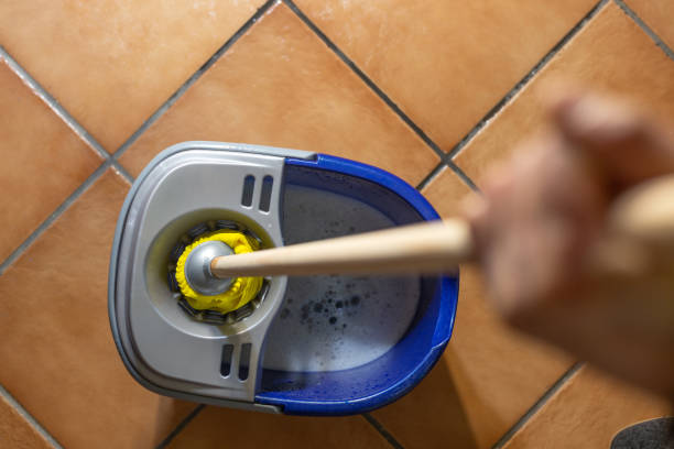 Madrid, Spain. Cleaning staff wringing the mop.
