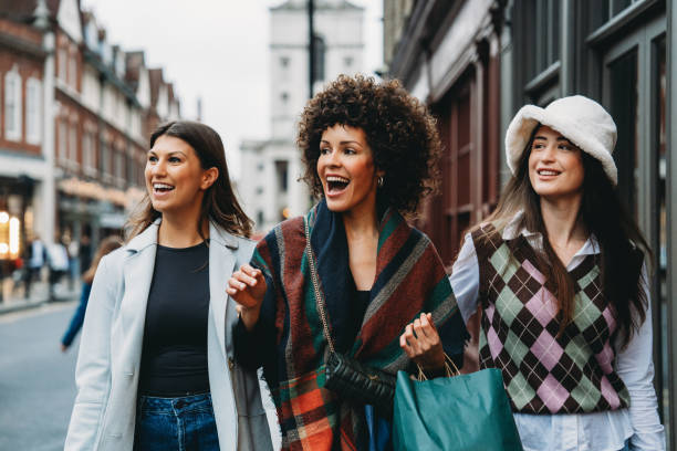 istock Three young women walking and talking on a shopping trip 2194066834