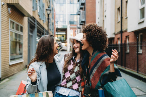 istock Three young women laughing together after shopping spree 2194066839
