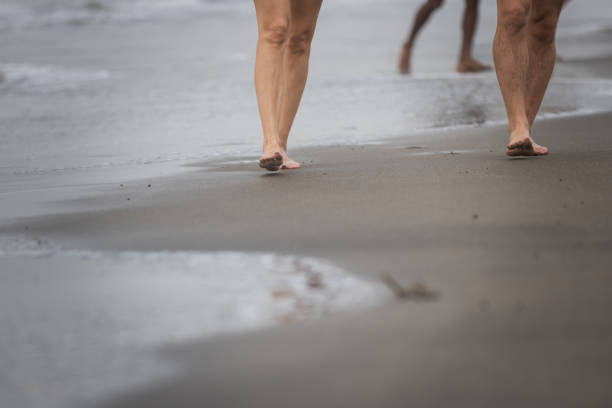 Young couple is walking on the Canggu beach.Indonesia - Bali Island.