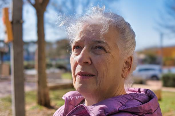 istock Portrait of an elderly gray-haired curly lady, copy space. 2194070706
