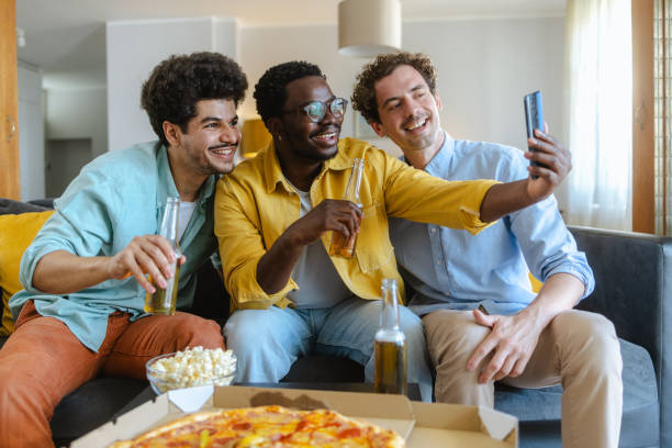 istock Three friends having fun taking a selfie during a casual gathering at home 2194070743