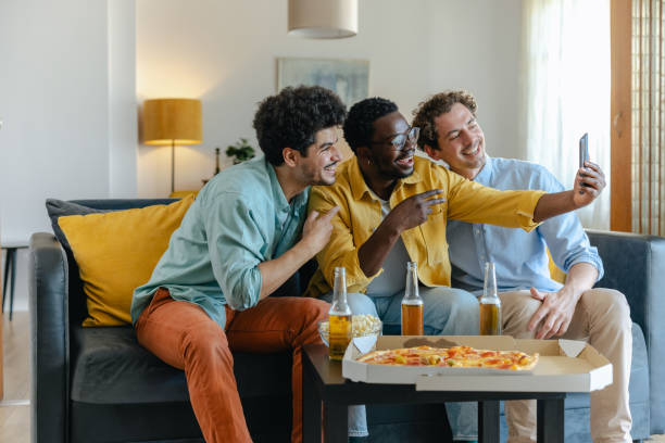istock Three friends having fun taking a selfie during a casual gathering at home 2194071278