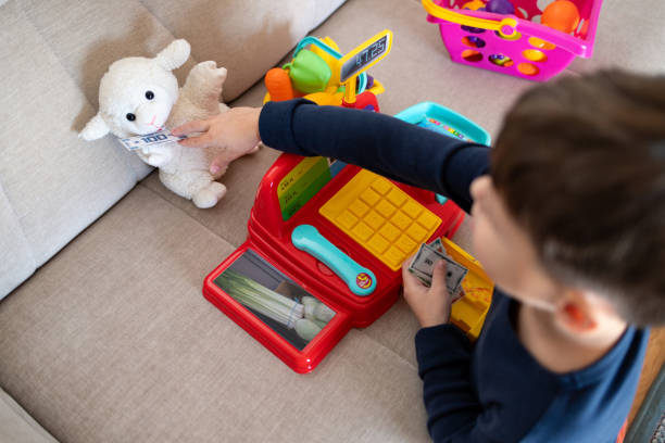 istock A child is playing store at home. 2194071410