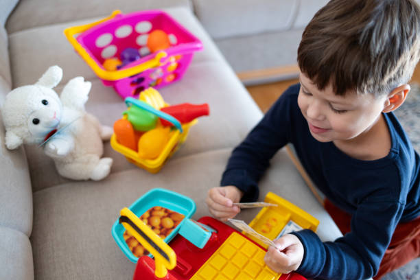 istock Playing Store with a Toy Cash Register 2194071414