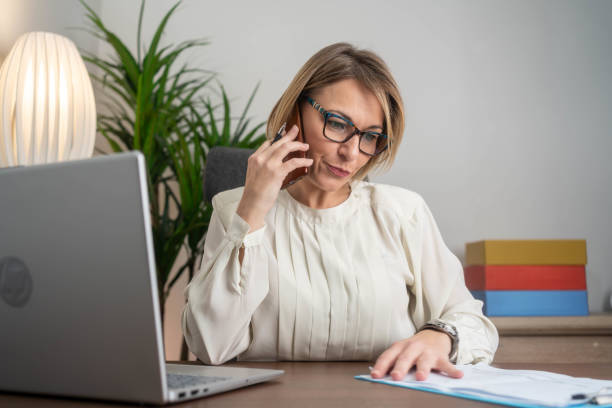 istock Displeased businesswoman using phone 2194072220