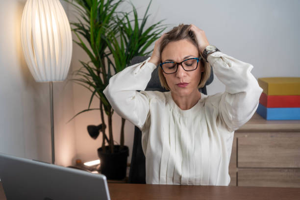 istock Business woman having headache at office 2194072221