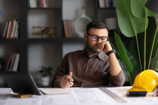 istock Artchitect Freelancer man drawing and designing home 2194072598