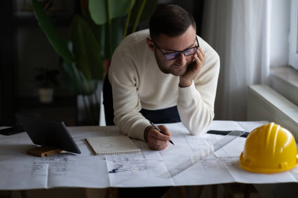 istock Artchitect Freelancer man drawing and designing home 2194074008