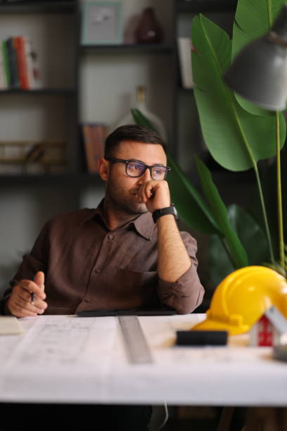 istock Artchitect Freelancer man drawing and designing home 2194074022