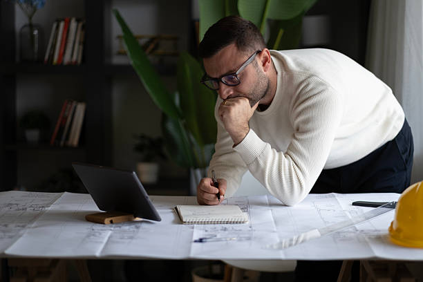 istock Artchitect Freelancer man drawing and designing home 2194074381